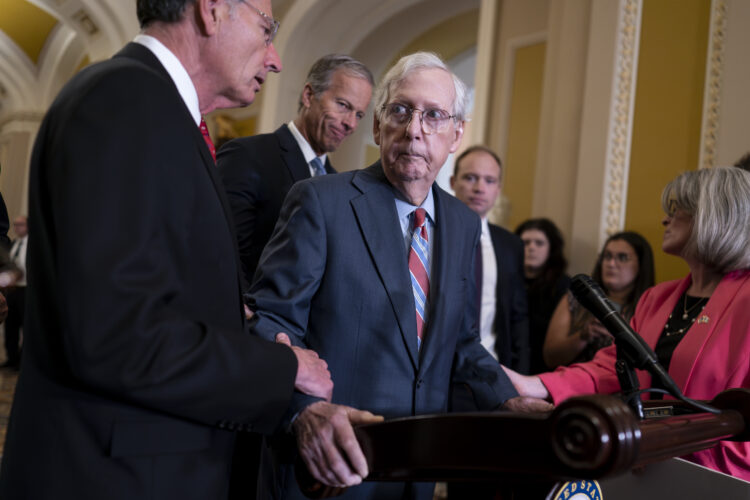 Senate Minority Leader Mitch McConnell froze up during a news conference on Wednesday, requiring colleagues to escort him away from the podium.