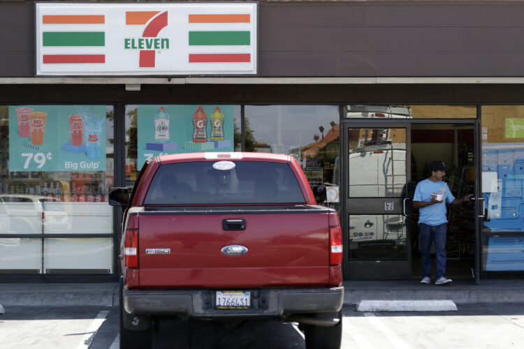 Two California 7-Eleven clerks are under police investigation after stopping a would-be robber by holding him down and beating him with a wooden stick.