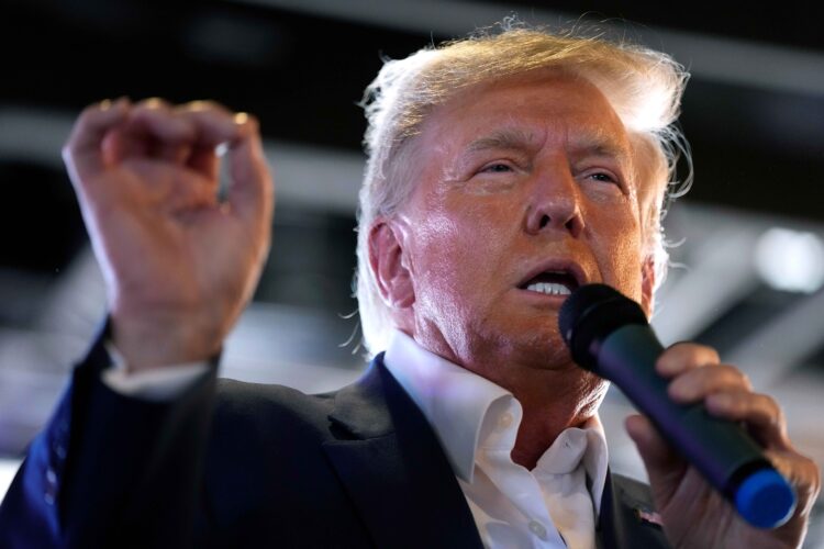 Donald Trump has agreed to surrender to Fulton County Jail on Thursday, accepting a $200,000 bond payment and restricted communication in exchange for release. | (AP Photo/Charlie Neibergall, File)