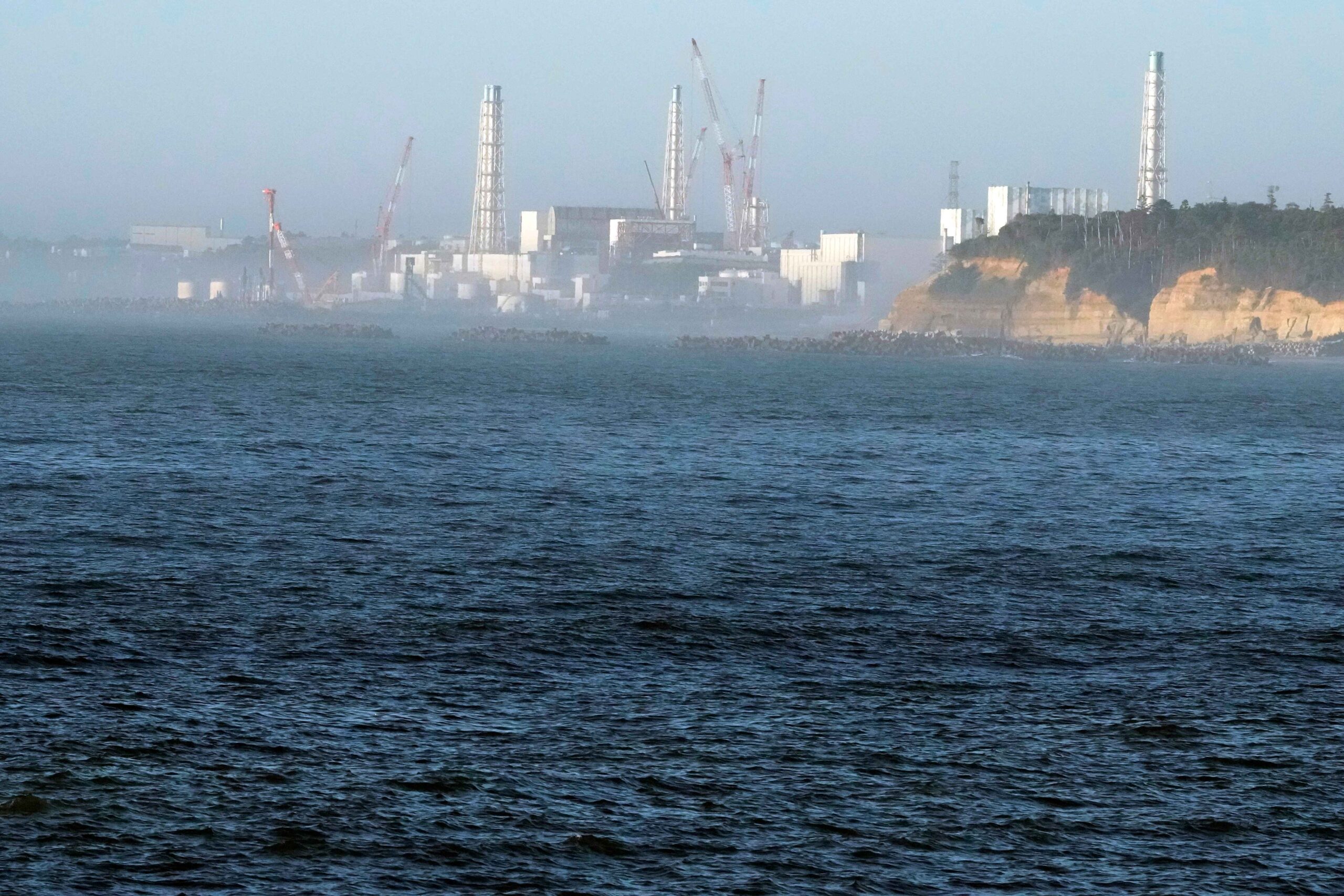 Japan is pumping wastewater from the defunct Fukushima Daiichi nuclear power plant into the Pacific Ocean, prompting protests from neighboring Asian countries. (AP Photo/Eugene Hoshiko)