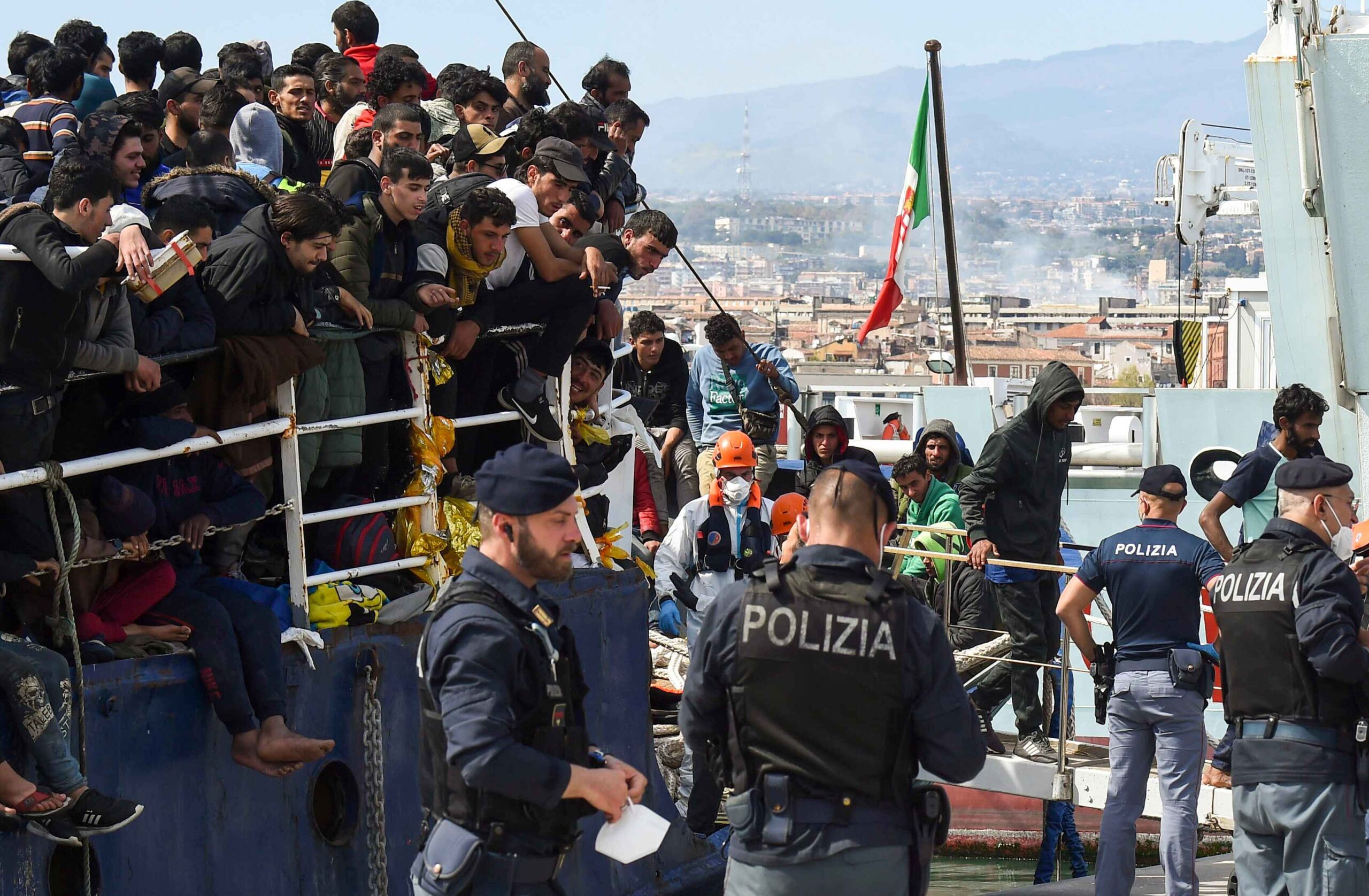 FILE - Migrants disembark from a ship in the Sicilian port of Catania, April 12, 2023. Some 110 million people around the world have had to flee their homes because of conflict, persecution, or human rights violations, the U.N. High Commissioner for Refugees says. (AP Photo/Salvatore Cavalli, File). Italian Prime Minister Giorgia Meloni is being accused of failing to deliver on her campaign promise to crack down on illegal boat migrants arriving in Italy.