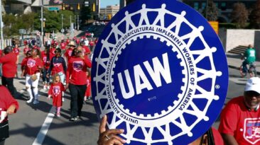 Members of the United Auto Workers (UAW), the largest labor union for automobile manufacturers in the United States, voted 97% in favor to authorize a strike against the Big Three American auto firms last week. (AP Photo/Paul Sancya, File)