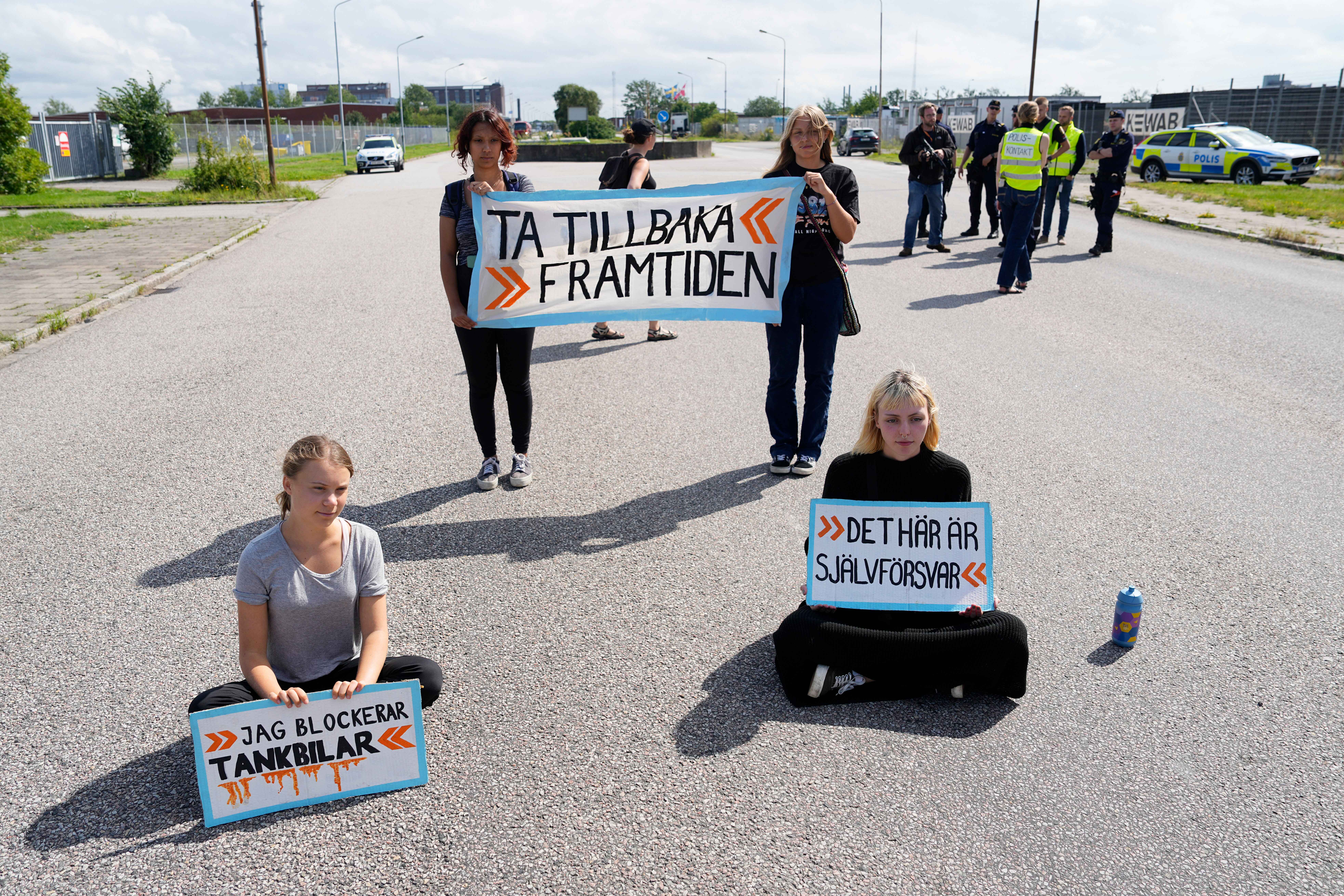 Swedish climate change activist Greta Thunberg has been charged a second time for disobeying a police order to leave a protest at a busy port in Sweden. AP Photo/Pavel Golovkin