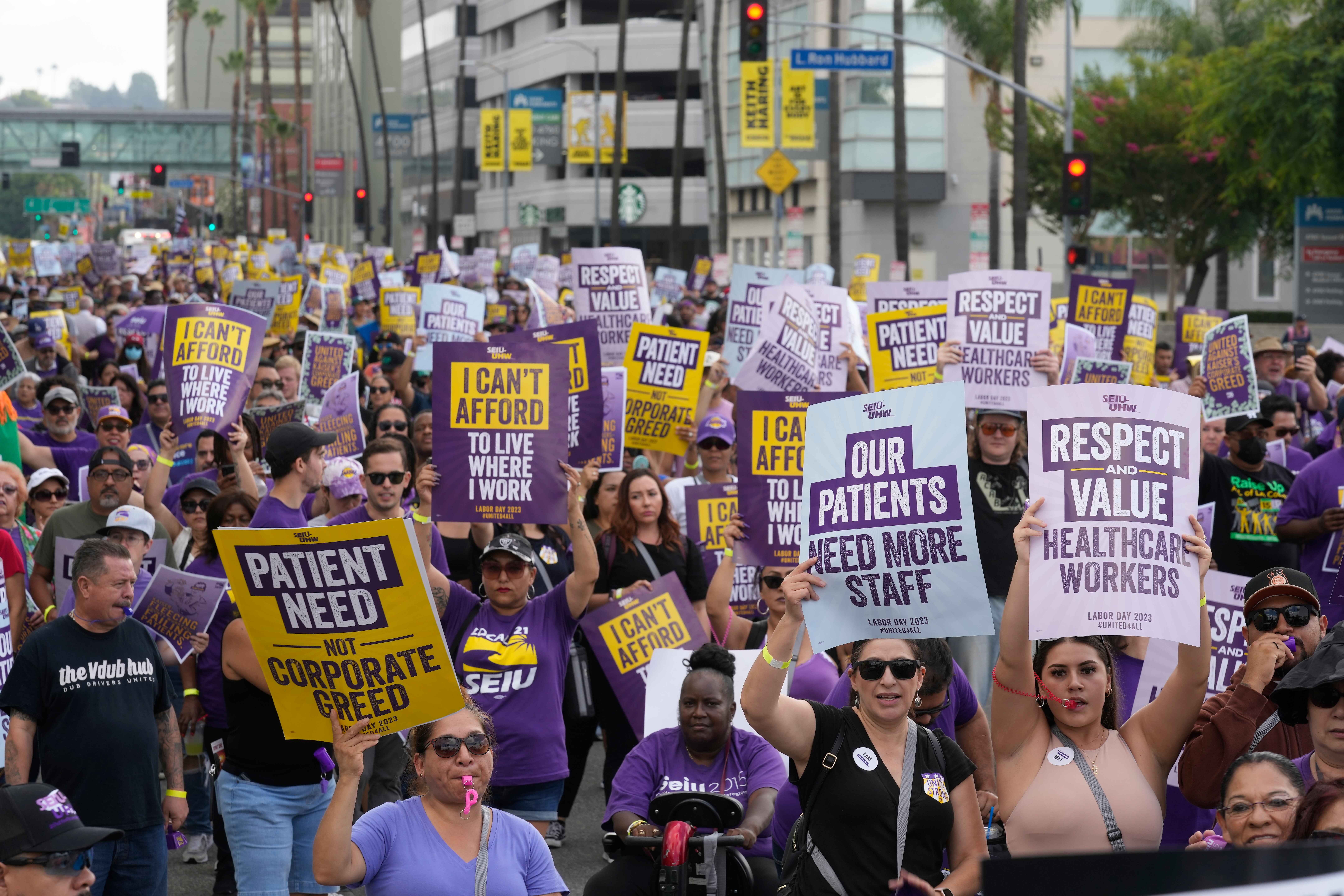 California's healthcare and food industry workers could receive more pay after the state legislature approved a measure to raise their minimum wage to $25 per hour. AP Photo/Damian Dovarganes