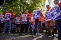 The United Auto Workers union has sent another 5,600 members to General Motors and Chrysler-parent Stellantis, expanding its work stoppage strike efforts.