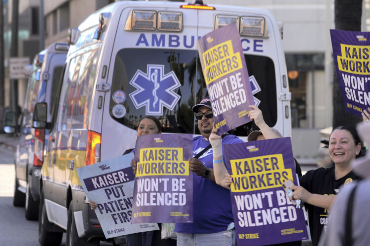 Kaiser Permanente reached a tentative agreement with unions representing 75,000 striking healthcare workers, moving to end the three-day industry strike. (AP Photo/Damian Dovarganes)