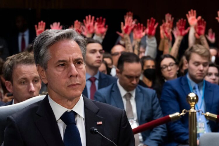 Antony Blinken had his Senate testimony interrupted by pro-Palestine protestors, who chanted in favor of a ceasefire and covered their hands with fake blood.