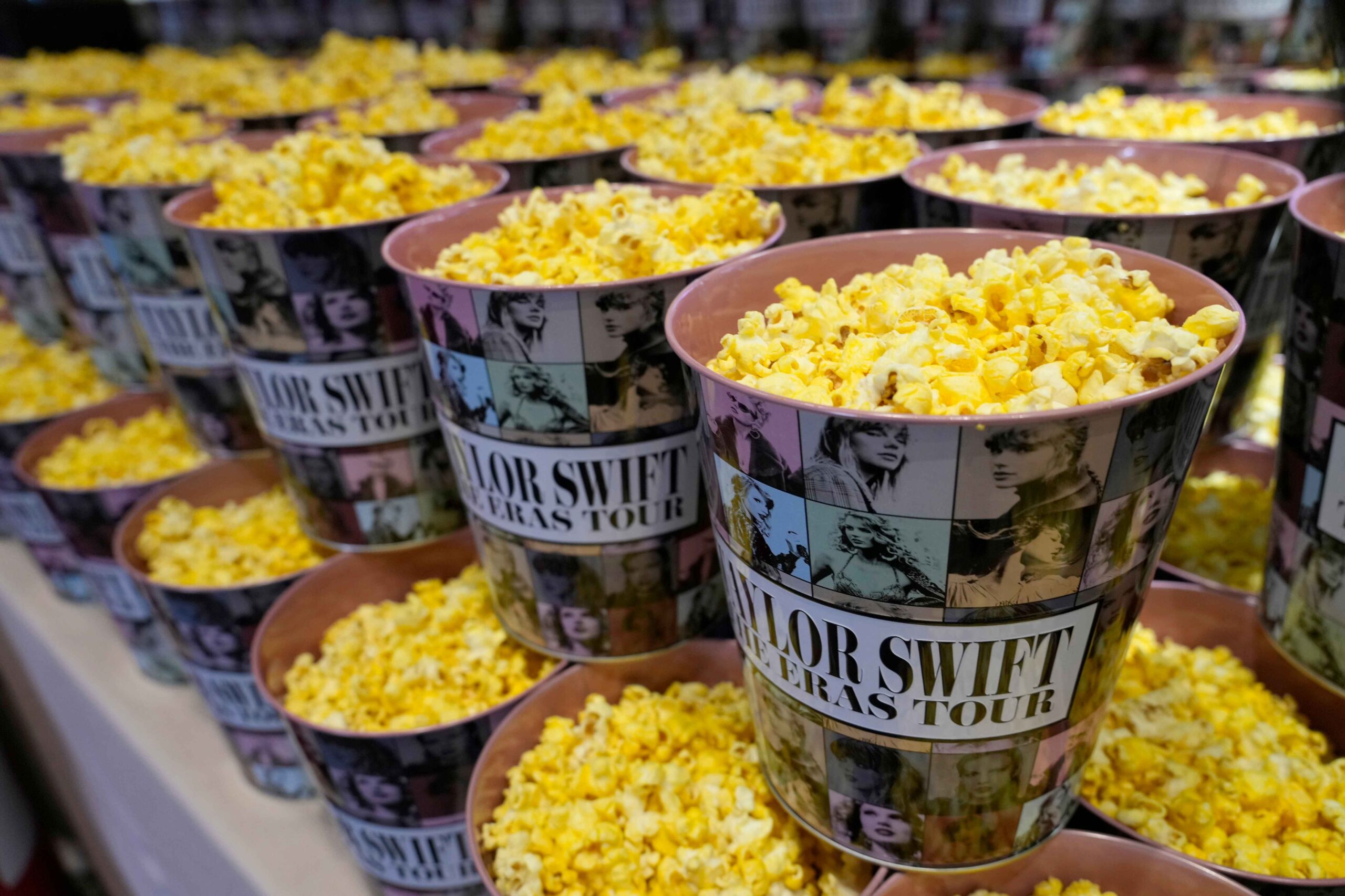 Movie theatres turned into concert venues over the weekend as Taylor Swift fans boosted the U.S. economy with the singer's new film setting a box-office record.