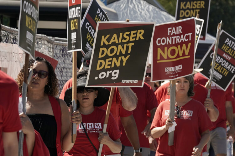 Thousands of workers from Kaiser Permanente hospitals and facilities walked off the job Wednesday morning, launching the largest healthcare strike in history.