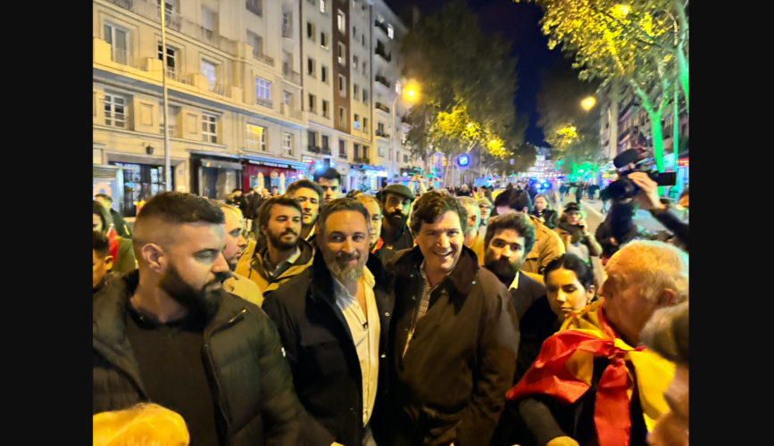 Tucker Carlson arrived in Madrid, Spain on Monday night to show support for the right-of-center protests going on there.