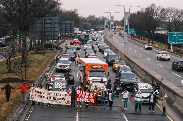 Dozens of pro-Palestine demonstrators blocked highways outside JFK and LAX, bringing traffic to a halt during one of the busiest travel weeks of the year. 