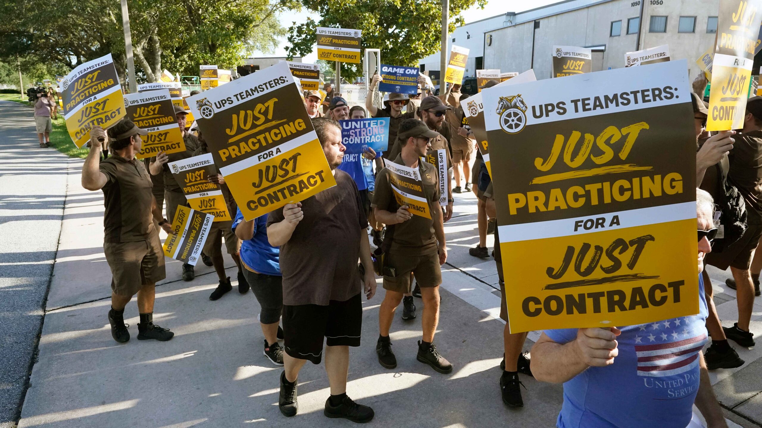 UPS will lay off more than 12,000 members of its management staff just five months after averting a union strike and giving drivers $170,000 paychecks. (AP Photo/John Raoux)