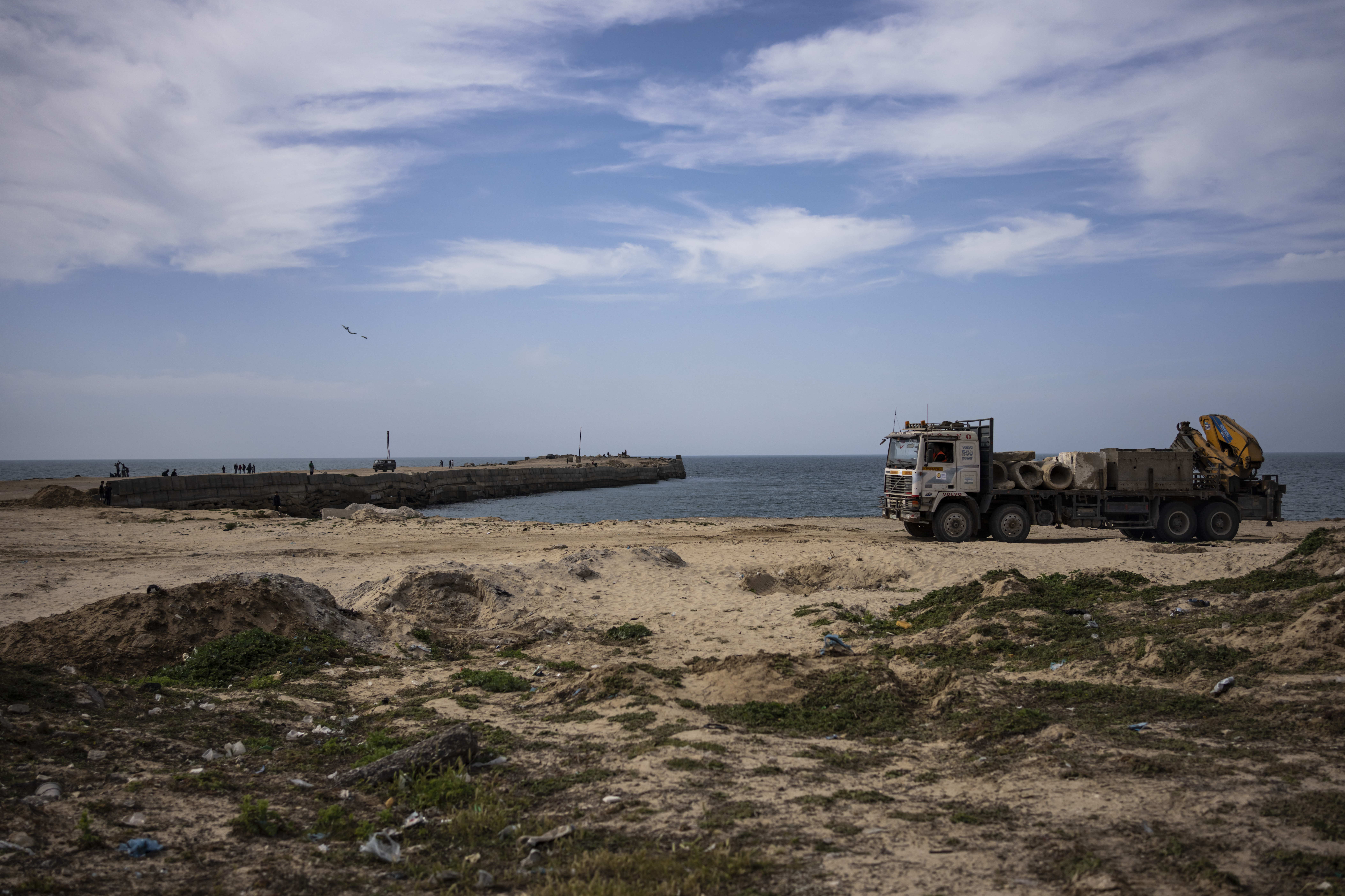 The US military's floating pier off the coast of Gaza came under mortar fire from suspected Hamas militants, jeopardizing plans to provide humanitarian aid.