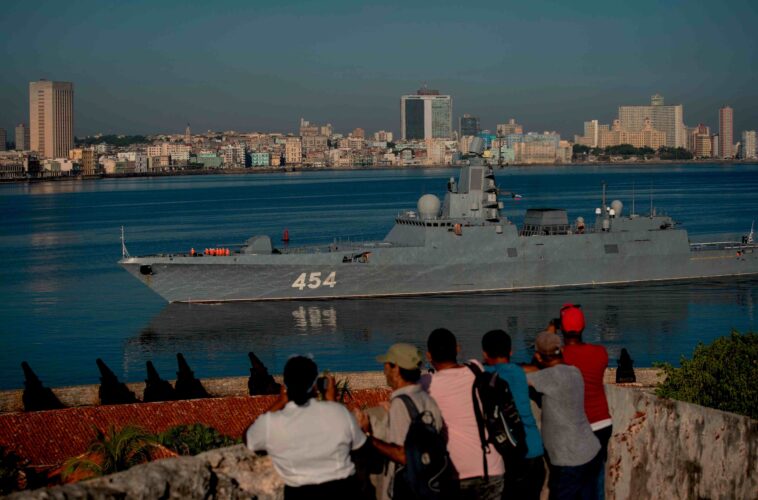 Tensions are escalating between Russia and the US, with Putin threatening to arm American enemies and Russian warships arriving in Cuba for exercises next week.