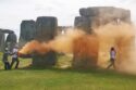 Two environmental activists have been charged with damaging the Stonehenge monument by spraying it with orange powder during a Just Stop Oil protest in June.