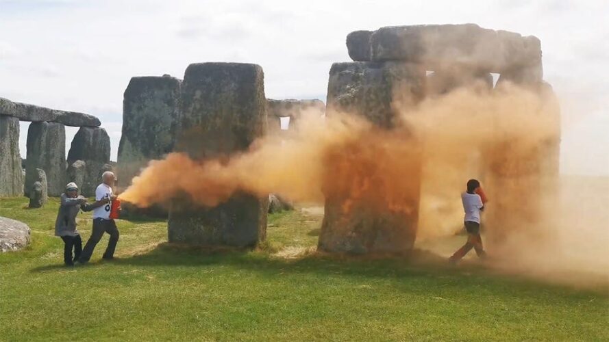 Two environmental activists have been charged with damaging the Stonehenge monument by spraying it with orange powder during a Just Stop Oil protest in June.