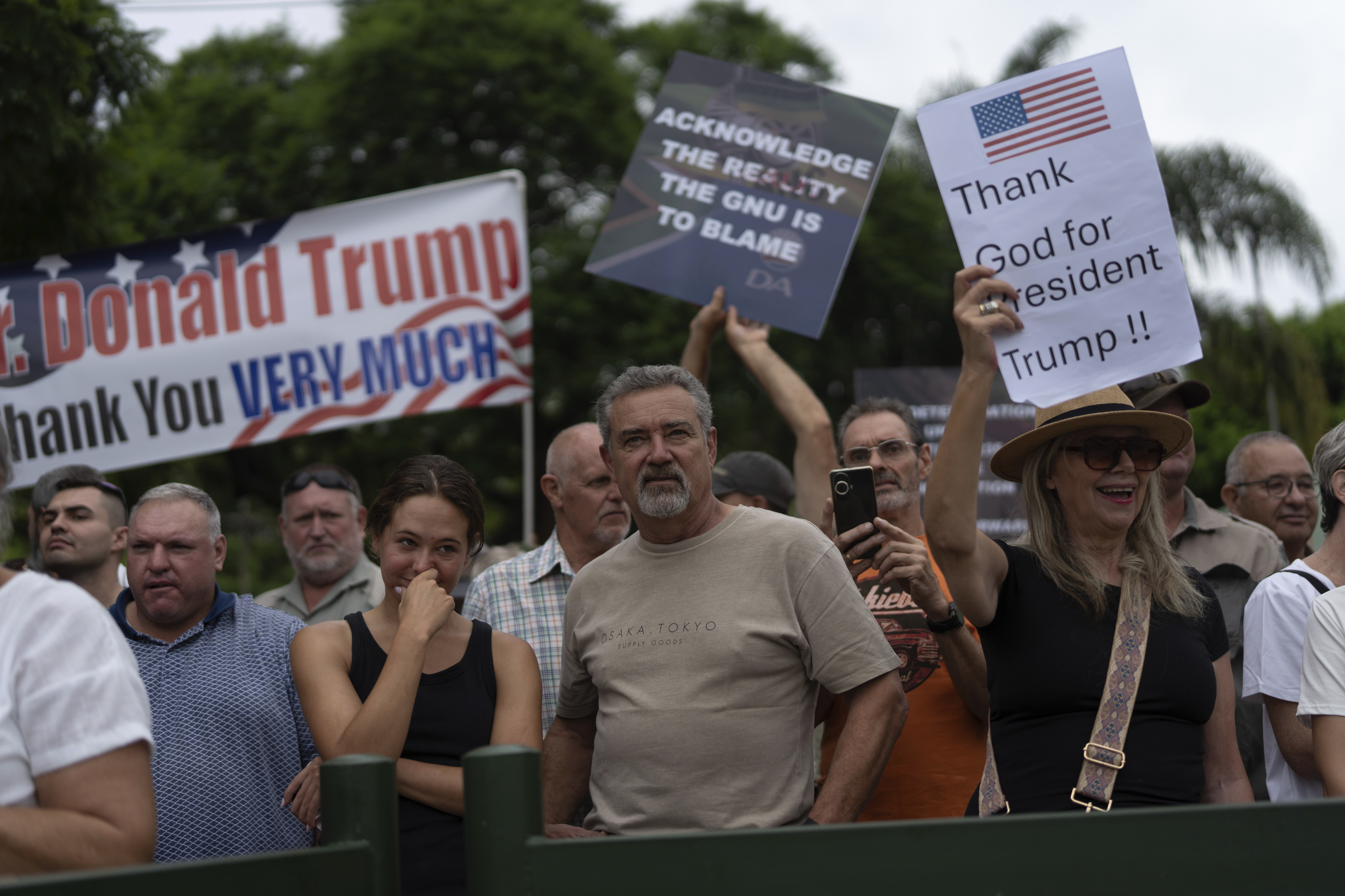 White South Africans gathered outside the US embassy in support of Donald Trump's efforts to cut off aid to South Africa over discrimination against Afrikaners.