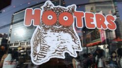 Hooters, known for its chicken wings and well-proportioned waitresses, is preparing to file for bankruptcy after suffering reduced traffic and growing debt.