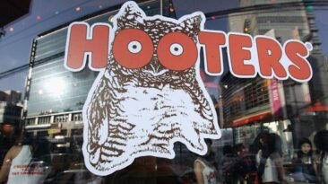 Hooters, known for its chicken wings and well-proportioned waitresses, is preparing to file for bankruptcy after suffering reduced traffic and growing debt.