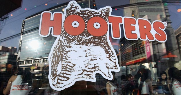 Hooters, known for its chicken wings and well-proportioned waitresses, is preparing to file for bankruptcy after suffering reduced traffic and growing debt.