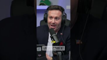 Podcast host in a dark blazer speaks into a large microphone while wearing over-ear headphones, with a 'VALUE' watermark visible in the background.